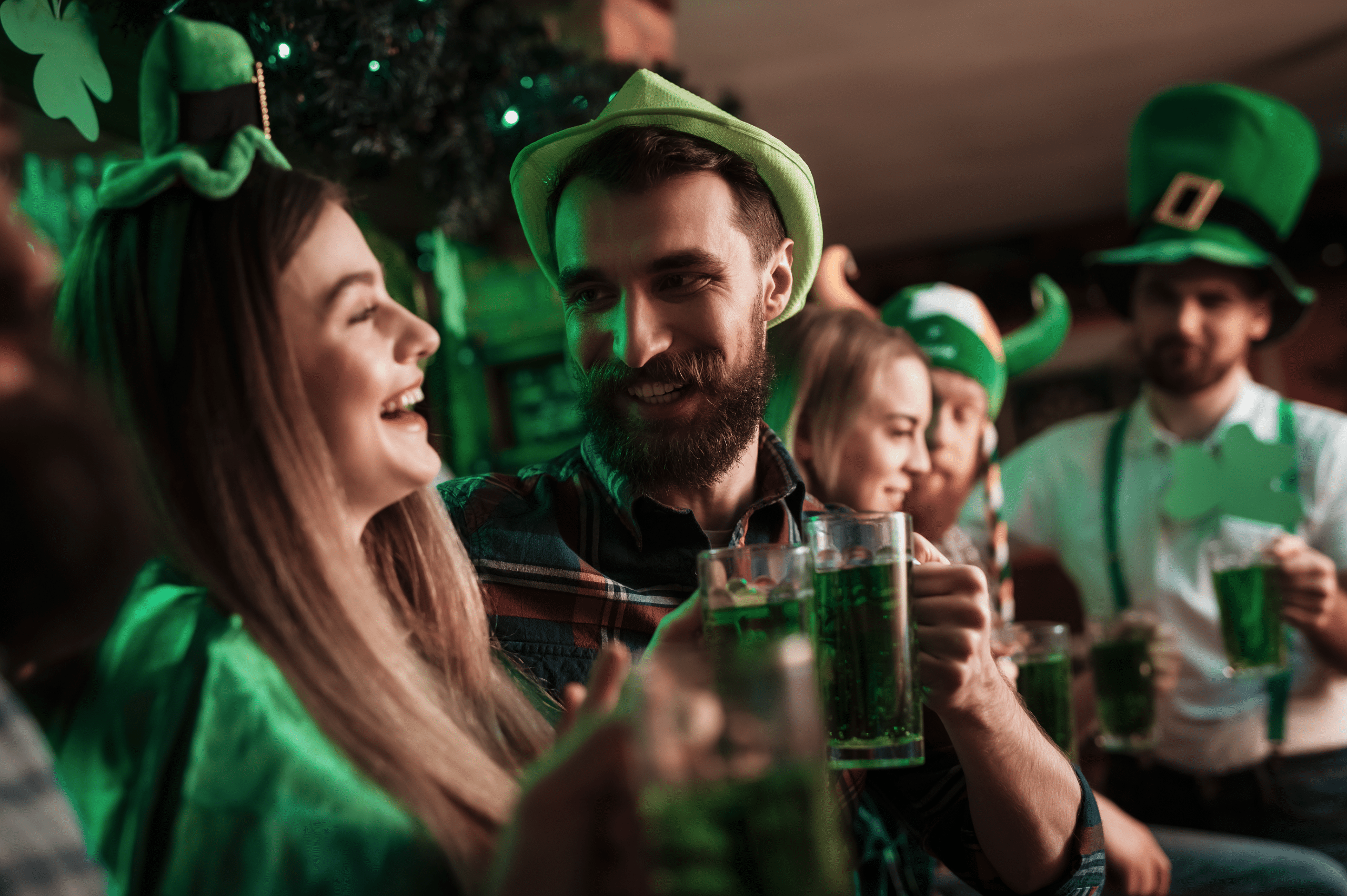 Young folk drinking green beer